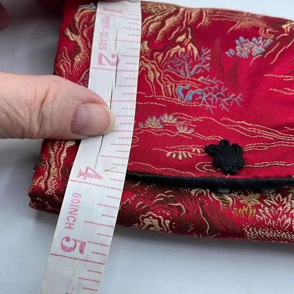 Vintage silk brocade jewelry roll. Snap front.